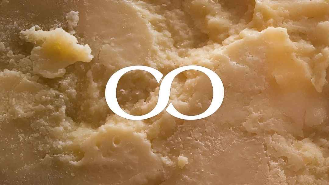 This is an image of texture of aged hard cheese with a granular, crumbly surface. You can buy all kind of top quality cheese now in UAE. The Cheeseroom have a collection of over 200 kinds of cheeses from all around the world.