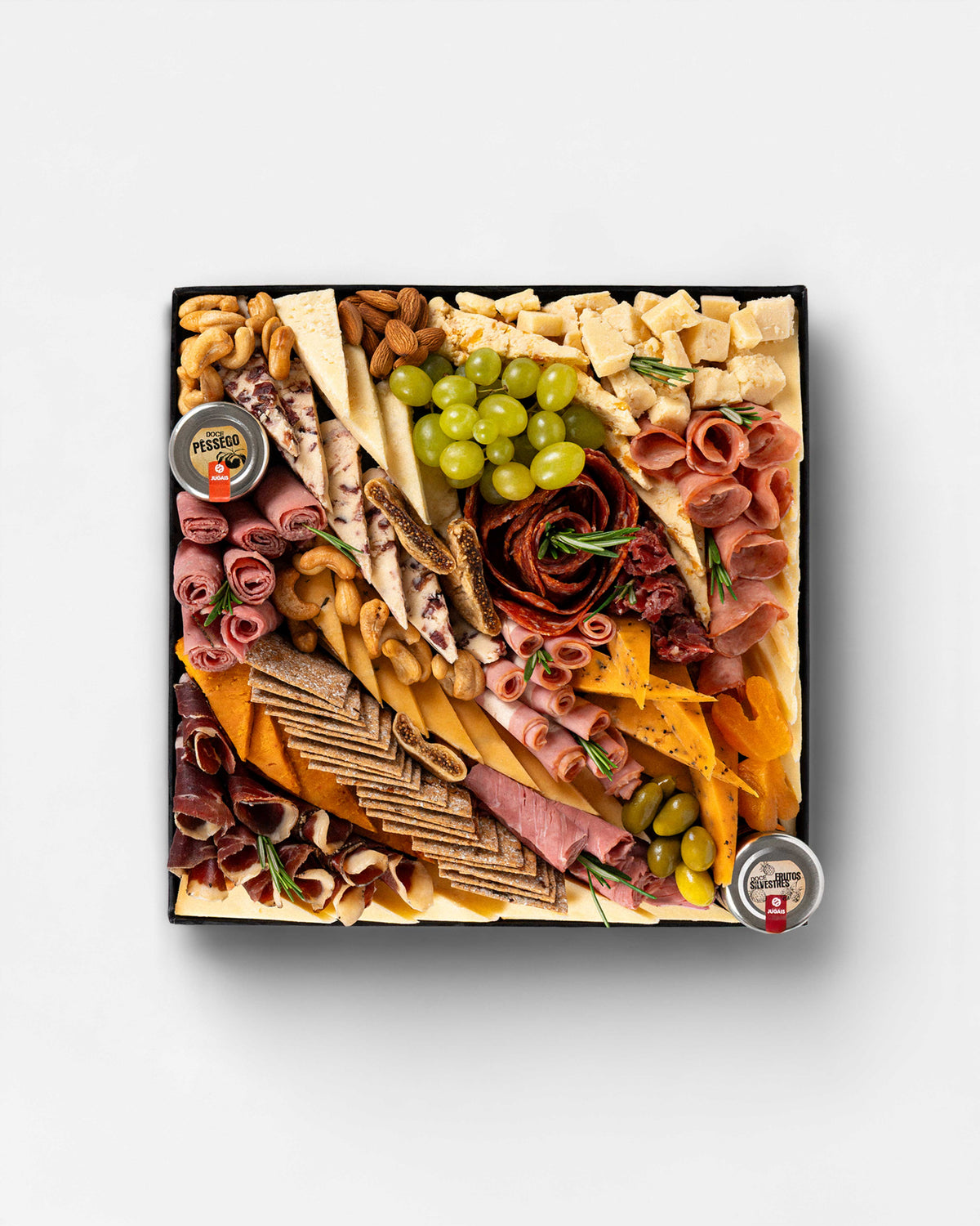 British Cheese & Charcuterie Board featuring hard, semi-hard, nutty, sweet, smoked, spiced and aromatic British cheeses, paired with halal turkey, veal, beef, lamb and goose cold cuts, artisanal crackers, green grapes, olives, almonds, cashews, walnuts and dried fruits. British cheese Dubai, British cheese platter Dubai, British cheese board Dubai, British cheese online Dubai, British artisanal cheese, cheese platter Dubai, cheese board Dubai, charcuterie board Dubai, British cheese delivery Dubai.
