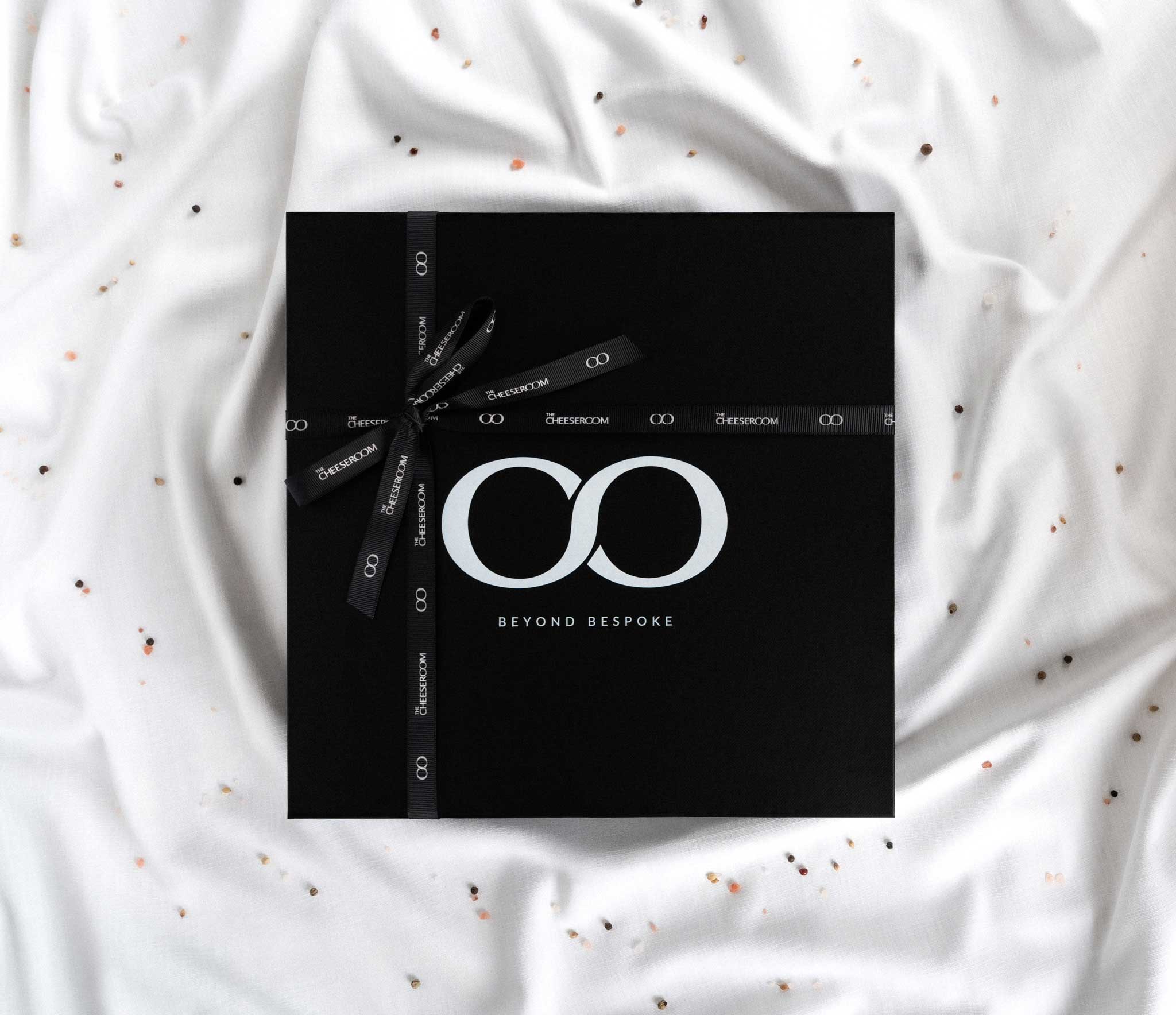 This image is providing visuals of our Cheese board packing prepared with love and artisanal cheeses from around the word.