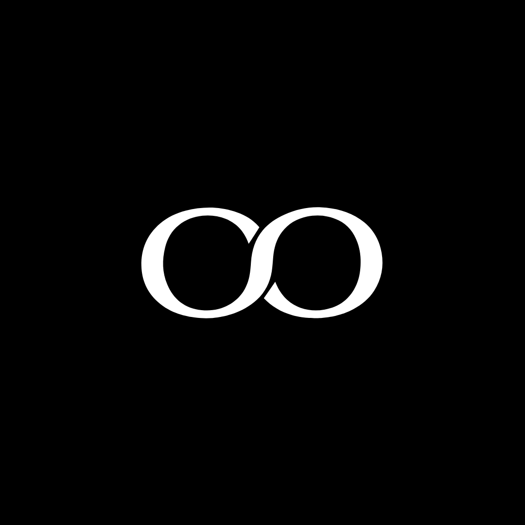This is the short version of The Cheeseroom logo. It's an infinity sign. Which represents our vision to provide artisanal cheese and other gourmet products with quality and love. Two white interlocking circles on a black background